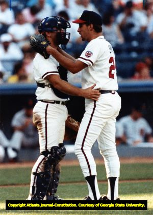 Braves' catcher Greg Olson gives pitcher John Smoltz a pep talk, 1990