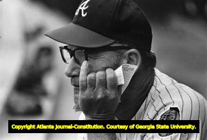 Braves' manager Luman Harris watching from the dug out, 1969
