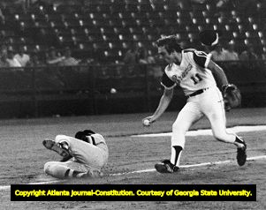 Atlanta Braves' Darrell Evans attempts to tag a downed runner, circa 1970s