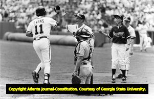 Atlanta Braves' bat boys greet Darrell Evans at home plate after hitting a home run, 1989