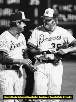 Atlanta Braves manager Dave Bristol consults with Phil Niekro, 1976 or 1977