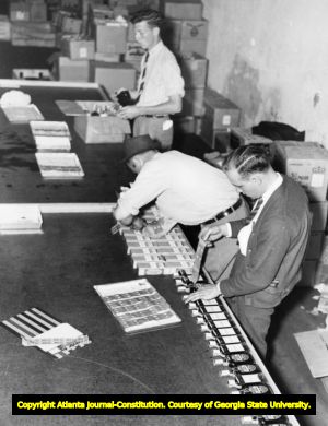 Liquor store warehouse prepares bottles with tax seals and labels after the overturn of prohibition, 1938