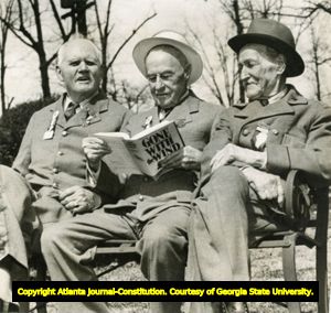Three Confederate veterans reading Margaret Mitchell's Gone with the Wind, Atlanta, Georgia, after 1936.