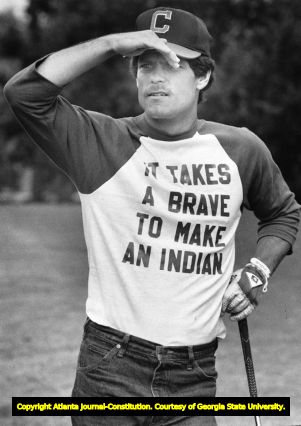 Brett Butler at a charity golf game wearing "It takes a Brave to make an Indian" shirt after being traded, 1983