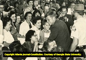 John F. Kennedy shaking hands with patients at the Georgia Warm Springs Foundation, Warm Springs, Georgia, during the presidential campaign, October 10, 1960.