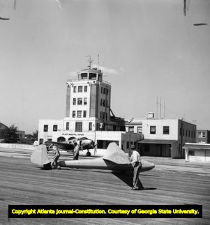 Captain Shelly Charlesa at Atlanta Municipal Airport before take off in his glider, 1952