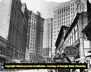Stores and pedestrians along Peachtree Street, circa 1900s