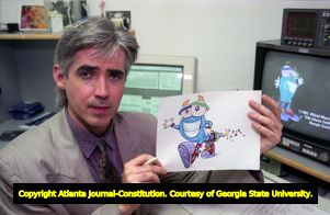 Olympic mascot designer John Ryan with an illustration of Whatizit "Izzy" for the Atlanta games, 1992