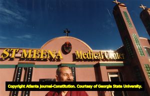 Dr. Abbas Demetrios stands outside his newly constructed clinic, St. Meena Medical Center, 1993