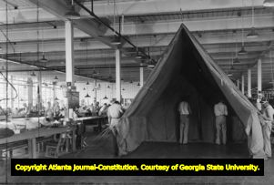 Prisoners at the Federal Penitentiary during World War II building tents for the military, 1941