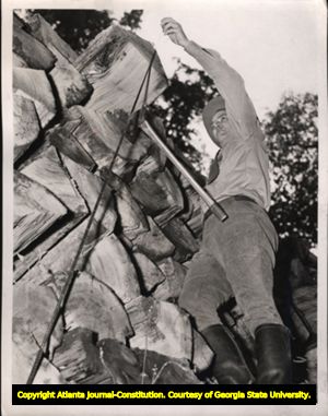 Measuring pulpwood pile, Georgia, 1940.