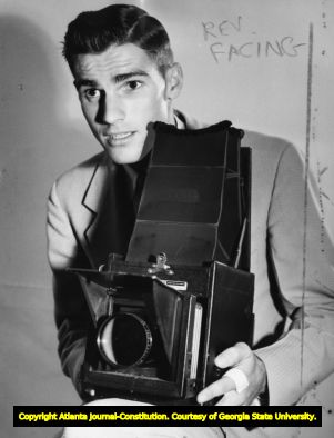 Atlanta Journal photographer Floyd Jillson with his Graphlex camera, 1940s