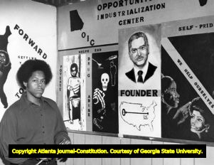 James Huff with his mural 'We Help Ourselves,' 1972