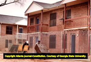 Moving furniture into renovated public housing apartments, Atlanta, Georgia, January 5, 1991.