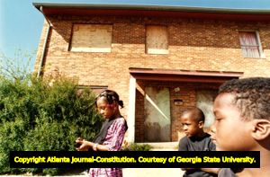 Children outside of East Lake Meadows, a notorious housing project in Atlanta, Georgia, March 22, 1990.