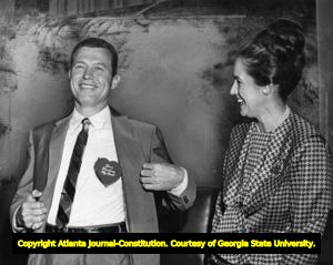 Governor Carl Sanders with a heartbreaker button on his birthday, 1964