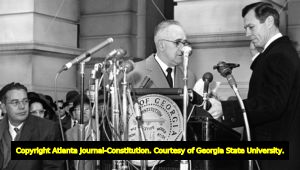 Governor Carl Sanders being sworn into office by Judge Quillian, 1963