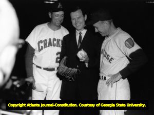 Governor Carl Sanders throws out the first pitch for an Atlanta Crackers game, 1960s