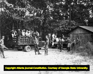 National Guard transporting striking textile workers to a prisoner camp, 1934
