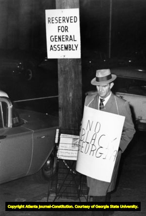 Demonstrator with a sign reading "No Black Georgia," 1961