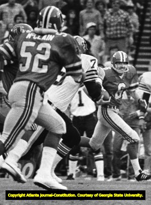 Atlanta Falcons' John James takes a bad snap for 13 yards and a first down, 1980