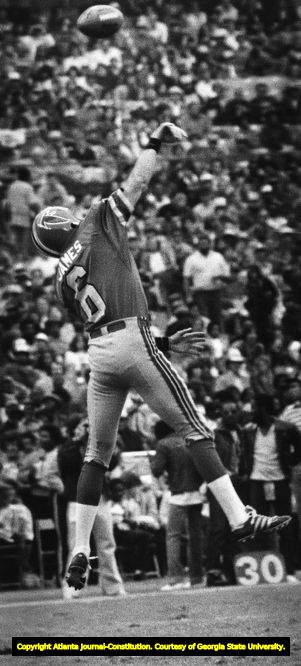 Falcons' John James tries to secure a high snap, 1980