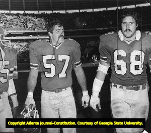 Falcons' player R. C. Thielemann with Jeff Van Note, 1980