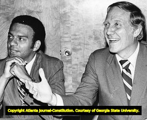 Georgia congressional candidate Andrew Young with Rodney Cook during a panel discussion, 1972