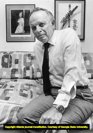 Architect Cecil A. Alexander discusses his late wife in his office, 1984