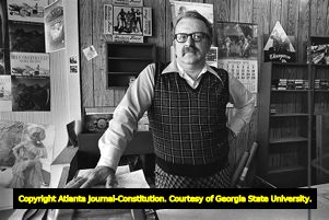 John Andrew running the front counter of his record store, 1978