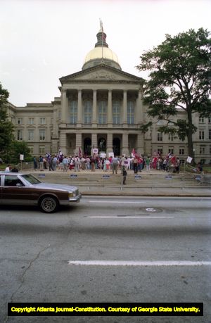 Demonstrators against changing the state flag protesting outside the State Capitol, 1992