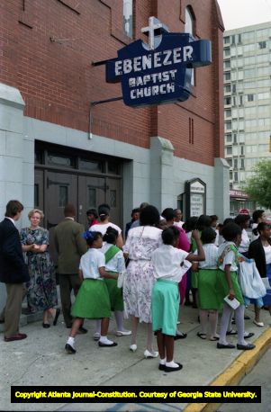 Church goers line up outside of Ebenezer Church, 1992