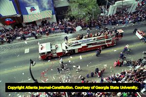 Atlanta Braves outfielders riding through downtown during the World Series victory parade, 1995