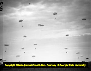 Paratroopers safely landing at Fort Benning during parachute training, 1942