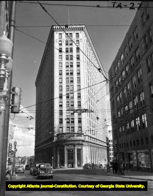 Cars and pedestrians outside the Hurt Building, 1950