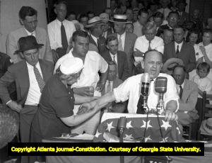 Supporters listen as Governor Ellis Arnall delivers a campaign speech, 1944
