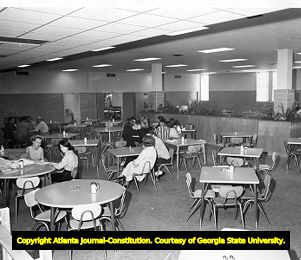 DeKalb College students socializing in the school's cafeteria, 1965
