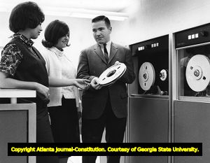 DeKalb College students studying the school's new computer, 1965