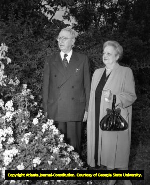 Senator Walter F. George with his wife in a garden, 1942