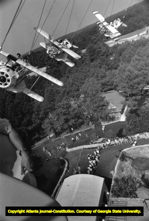 The Great Six Flags Air Racer ride whirls above the crowds, 1984