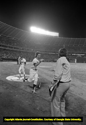 Atlanta Braves owner Ted Turner congratulating Ken Henderson on a homerun, 1976