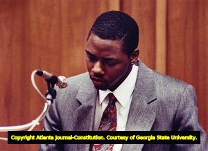 Witness William Maurice Porter apologizes to Julie Love's parents during his murder trial, 1990