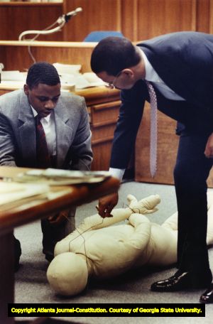 Witness William Maurice Porter demonstrates in court how the murder victim Julie Love was strangled, 1990