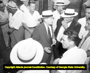 Gubernatorial candidate M. E. Thompson meets with supporters during a campaign rally, 1954