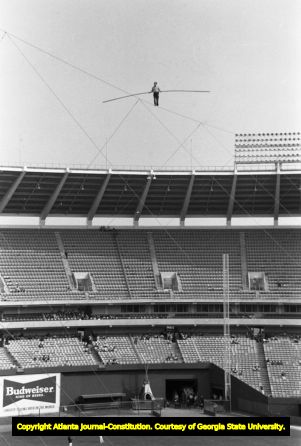 High wire artist Karl Wallenda tightrope walking across Fulton County Stadium, 1977