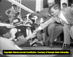 Gov. Eugene Talmadge meets with supporters at a campaign event, 1946