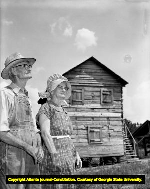 Farmers Jess and Ella Wilbanks on the historic Native American site of New Echota, 1960