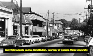 Cars parked along storefronts in Virginia Highlands, 1987
