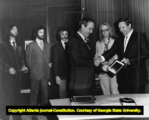 Governor George Busbee honoring members of the Atlanta Rhythm Section for their heroism, 1979