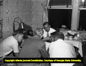 Governor M. E. Thompson with campaign members during election night, 1948